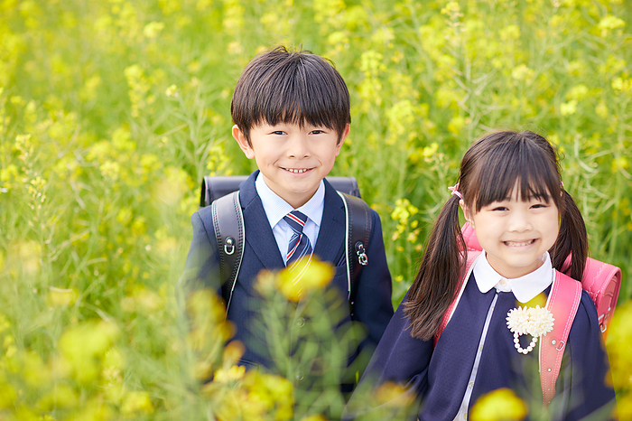 Rape blossoms and smiling Japanese elementary school students