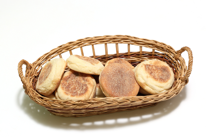 English muffins in baskets with white background