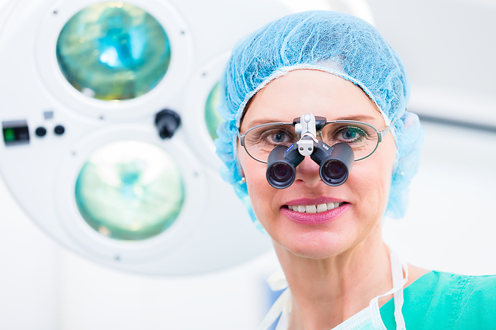 Orthopedic surgeon with special glasses  Orthopedic surgeon with special glasses in operating room