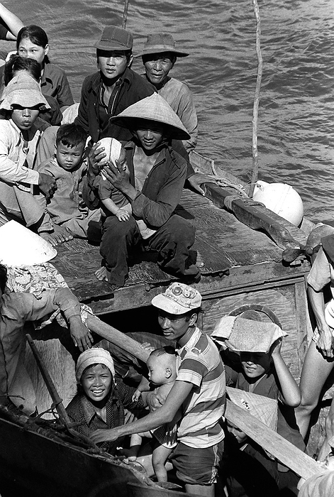 Vietnam: A group of refugee  boat people  escaping from communist rule somewhere in the South China Sea, 1984 Boat people is a term that usually refers to refugees or asylum seekers who emigrate in numbers in boats that are sometimes old and crudely made. The term came into common use during the late 1970s with the mass departure of Vietnamese refugees from Communist controlled Vietnam, following the Vietnam War. br   br    Many Vietnamese boat people   though not all   came from the south, the former Republic of Vietnam  also, many were Hoa or ethnic Chinese. 
