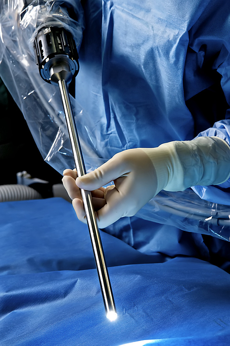 Doctor holding robotic surgical equipment, Photo by Donna Victor / Design Pics