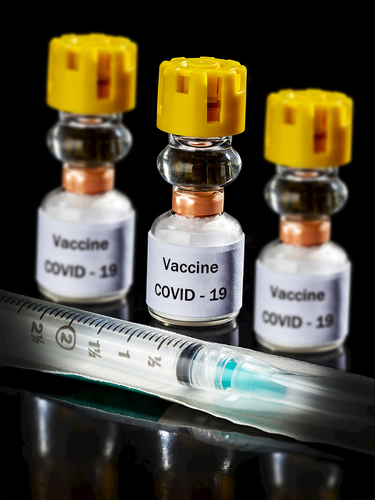 Medical Vaccine COVID-19 vials and syringe on a black background; Studio, Photo by Michael Interisano / Design Pics