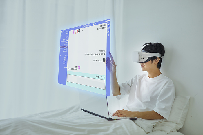 Japanese man wearing VR goggles Metaverse