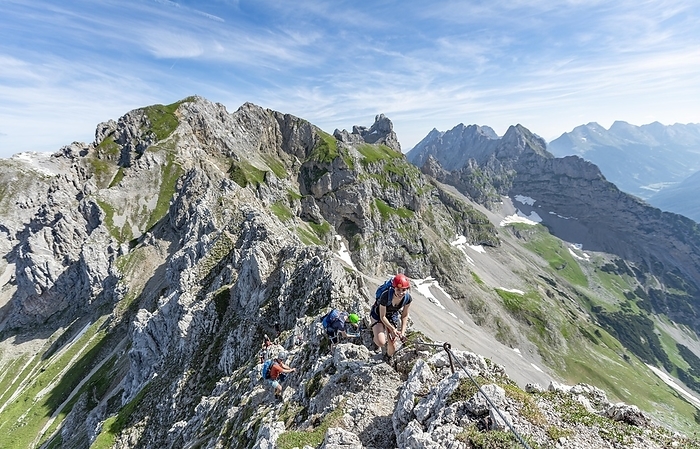 Mountaineer on a ridge on a secured via ferrata, Mittenwalder Höhenweg, view of mountain ridge, Karwendel Mountains, Mittenwald, Bavaria, Germany, Europe, Photo by Mara Brandl