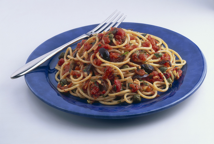 Spaghetti with harlot s sauce Spaghetti with harlot s sauce: A blue plate with spaghetti with a tomato based vegetable sauce., Photo by DK IMAGES SCIENCE PHOTO LIBRARY