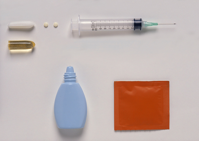 Different forms of drugs Syringe with needle  injectable solutions , sublingual pill, plastic bottle containing nasal spray, suppository, powder in a sachet., Photo by DK IMAGES SCIENCE PHOTO LIBRARY