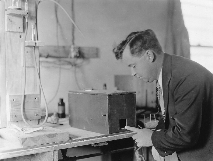 Robert Burt, US physicist and inventor Editorial use only   Robert C Burt  b. 1896 , US physicist and inventor, with a photoelectric cell developed for use in burglar alarm systems. Photoelectric cells are used to convert light falling on them into electricity. In an alarm system, the absence of light falling on the cell and the resulting drop in electrical current triggers the alarm.  