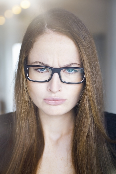 Young woman with eyeglasses, portrait, Photo by Eric Remann/F1online
