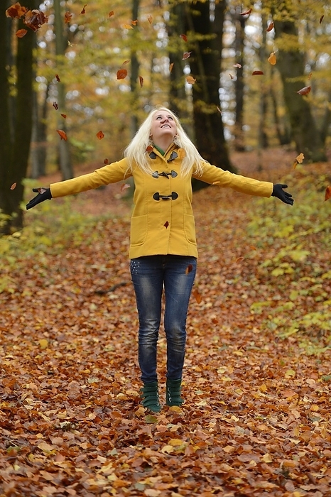 Happy blond young woman in forest, Photo by David & Micha Sheldon/F1online