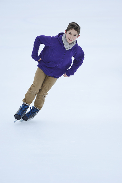 Boy ice-skating on a frozen lake, Photo by David & Micha Sheldon/F1online