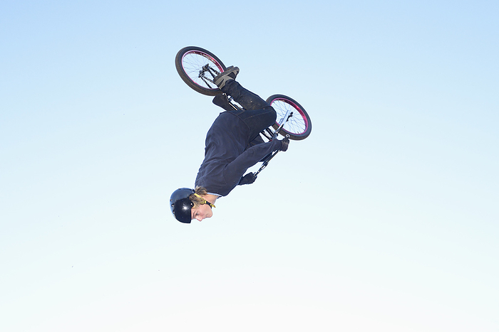 Teenager jumping in the air with his bmx bike, Photo by David & Micha Sheldon/F1online