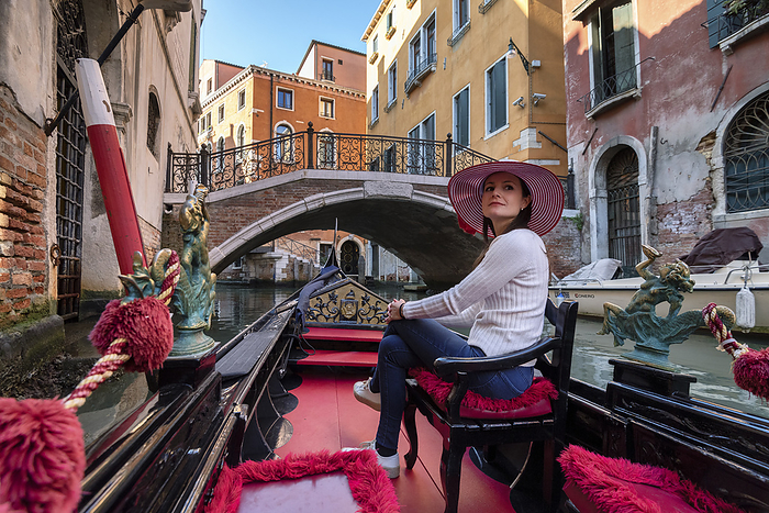 Venice Young girl in a gondola tour in Venice, Veneto, Italy, Europe, Photo by Alessandro Bellani