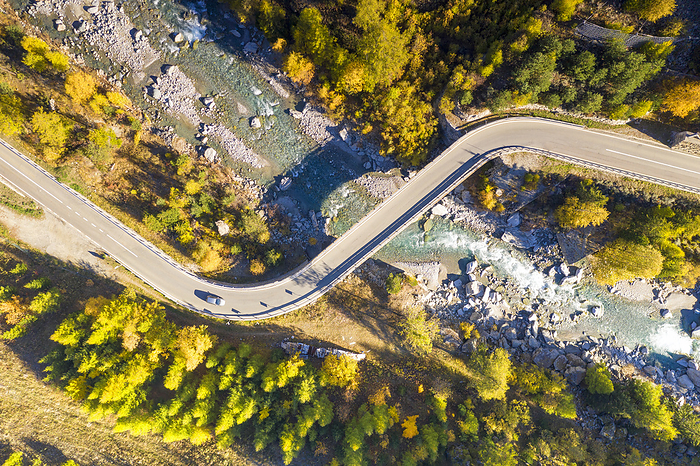 Italy aerial view of the road that crosses the Cogne valley in autumn day, municipality of Cogne, Aosta province, Valle d Aosta district, Italy, Europe, Photo by Carlo Conti