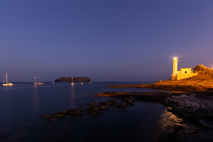 Italy The Roman Port area of Ventotene with the lighthouse. In the background the island of Santo Stefano with its prison. Europe, Italy, Lazio, Province of Latina, Island of Ventotene, Photo by Gianluca Laurentini