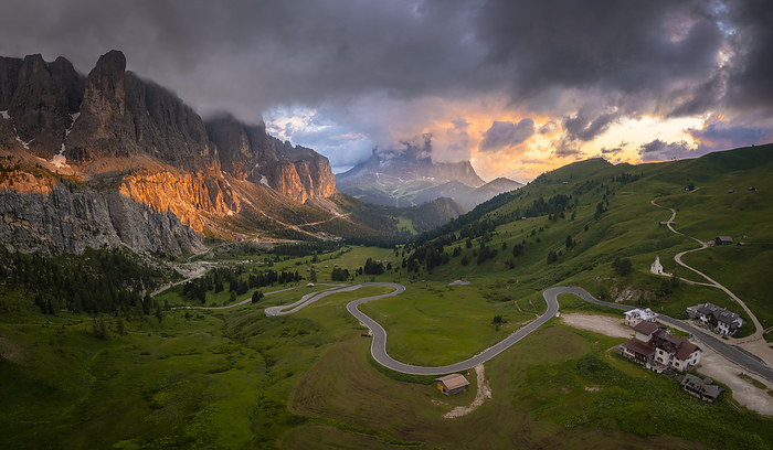 Italy Dolomites Aerial view of Gardena Pass at sunset after a storm. Dolomites, South Tyrol, Bolzano district, Italy, Europe., Photo by Mirko Costantini