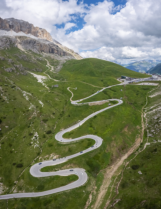 Dolomites, Italy Aerial view of the winding road of the Pordoi Pass during a summer day. Fassa Valley, Dolomiti, Canazei, Trento province, Trentino Alto Adige district, Italy, Europe., Photo by Mirko Costantini