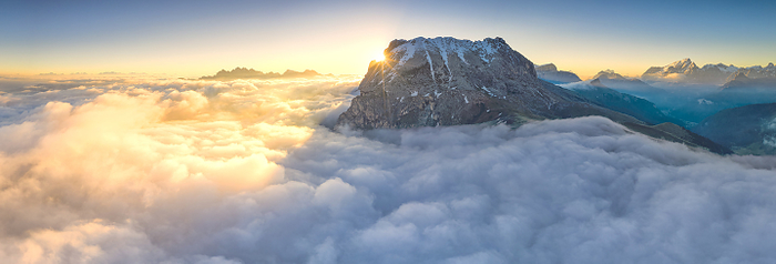 Italy Dolomites Aerial panoramic of Sassopiatto, Odle Group and Marmolada in a sea of clouds at dawn, Dolomites, Trentino Alto Adige, Italy, Photo by Roberto Moiola