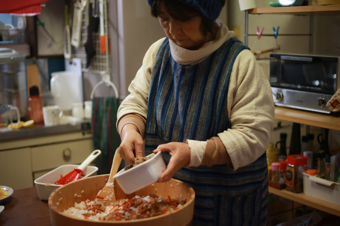 Woman making chirashi-sushi