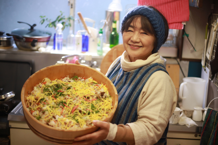 Woman with Chirashi Sushi