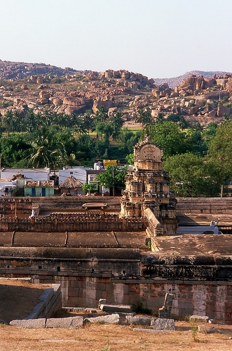 India: The Virupaksha Temple in its rocky surroundings, Hampi, Karnataka State The Virupaksha Temple  also known as the Pampapathi Temple  is Hampi s main centre of pilgrimage. It is fully intact among the surrounding ruins and is still used in worship. The temple is dedicated to Lord Shiva, known here as Virupaksha, as the consort of the local goddess Pampa who is associated with the Tungabhadra River. br   br    Hampi is a village in northern Karnataka state. It is located within the ruins of Vijayanagara, the former capital of the Vijayanagara Empire. Predating the city of Vijayanagara, it continues to be an important religious centre, housing the Virupaksha Temple, as well as several other monuments belonging to the old city.