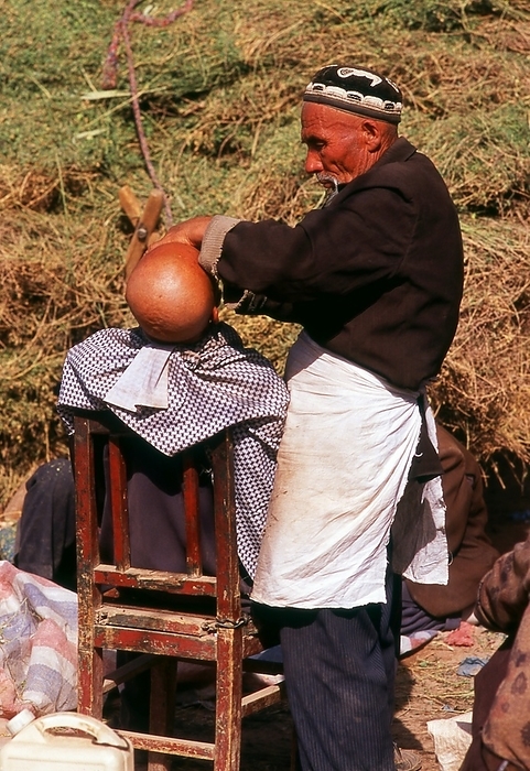 China: A shave in the sun, Kashgar, Xinjiang Province The earliest mention of Kashgar occurs when a Chinese Han Dynasty  206 BCE   220 CE  envoy traveled the Northern Silk Road to explore lands to the west.  br   br  The earliest mention of Kashgar occurs when a Chinese Han Dynasty  206 BCE   220 CE  envoy traveled the Northern Silk Road to explore lands to the west.  Another early mention of Kashgar occurs during the Former Han  also known as the Western Han Dynasty , when in 76 BCE the Chinese conquered the Xiongnu, Yutian  Khotan , Sulei  Kashgar , and a group of states in the Tarim basin almost up to the foot of the Tian Shan mountains. br   br  The Chinese conquered the Xiongnu, Yutian  Khotan , Sulei  Kashgar , and a group of states in the Tarim basin almost up to the foot of the Tian Shan mountains.  Ptolemy spoke of Scythia beyond the Imaus, which is in a  Kasia Regio , probably exhibiting the name from which Kashgar is formed.  br   br   br  Ptolemy spoke of Scythia beyond the Imaus, which is in a  Kasia Regio , probably exhibiting the name from which Kashgar is  The country s people practised Zoroastrianism and Buddhism before the coming of Islam. Bughra Khan converted to Islam late in the 10th century and his Uighur kingdom lasted until 1120 but was distracted by complicated dynastic struggles.  br   br  The celebrated Old Uighur prince Sultan Satuq Bughra Khan converted to Islam late in the 10th century and his Uighur kingdom lasted until 1120 but was distracted by complicated dynastic struggles.  The Uighurs employed an alphabet based upon the Syriac and borrowed from the Nestorian, but after converting to Islam widely used also an Arabic script. They spoke a dialect of Turkic preserved in the Kudatku Bilik, a moral treatise composed in 1065.