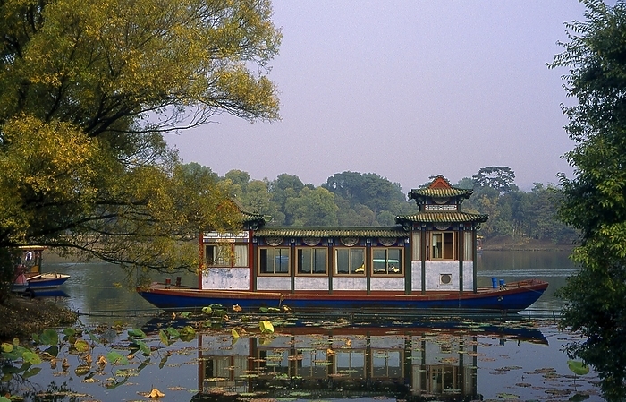 China: Pleasure boat on the lake, Imperial Summer Villa  Bishu Shanzhuang , Chengde, Hebei Province In 1703, Chengde was chosen by the Kangxi Emperor as the location for his summer residence. Constructed throughout the eighteenth century, the Mountain Resort was used by both the Yongzheng and Qianlong emperors. The site is currently a UNESCO World Heritage Site. Since the seat of government followed the emperor, Chengde was a political center of the Chinese empire during these times. br   br    Chengde, formerly known as Jehol, reached its height under the Qianlong Emperor 1735 1796  died 1799 . The great monastery temple of the Potala, loosely based on the famous Potala in Lhasa, was completed after just four years of work in 1771. It was heavily decorated with gold and the emperor worshipped in the Golden Pavilion. In the temple itself was a bronze gilt statue of Tsongkhapa, the Reformer of the Gelugpa sect.