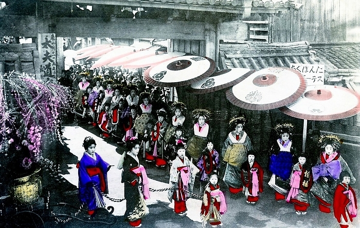 Japan: Oiran and Kamuro at a Tayu Procession, c. 1910 The oiran were considered a type of y jo  prostitute   woman of pleasure  or prostitute. However, they were distinguished from the y jo in that they were entertainers, and many became celebrities of their times outside the pleasure districts. Their art and fashions often set trends among the wealthy and, because of this, cultural aspects of oiran traditions continue to be preserved to this day. br   br  They were distinguished from the y jo  woman of pleasure  or prostitute.  The oiran arose in the Edo period  1600 1868 . At this time, laws were passed restricting brothels to walled districts set some distance from the city center. In the major cities these were the Shimabara in Kyoto, the Shinmachi in Osaka, and the Yoshiwara in Edo  present day Tokyo .  br   br   br  These are the major cities.  These rapidly grew into large, self contained  pleasure quarters  offering all manner of entertainments. Within, a courtesan s birth held no distinction, which was fortunate considering many of the courtesans originated as the daughters of impoverished families who were sold into this lifestyle as indentured servants.   Among the oiran, the tay   tayu  was considered the highest rank of courtesan and were considered suitable for the daimyo or feudal lords. In the mid 1700s courtesan rankings began to disappear and courtesans of all classes were collectively known simply as  oiran .  br   br    The word oiran comes from the Japanese phrase oira no tokoro no n san            which translates as  my elder sister . When written in Japanese, it consists of two kanji, flower meaning  flower , and kai meaning  leader  or  first , hence  Leading Flower  or  First Flower .