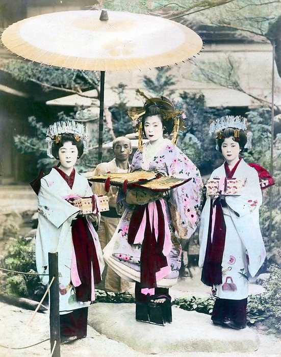 Japan: Oiran or courtesan with two kamuro or maid attendants, c. 1905 The oiran were considered a type of y jo  prostitute   woman of pleasure  or prostitute. However, they were distinguished from the y jo in that they were entertainers, and many became celebrities of their times outside the pleasure districts. Their art and fashions often set trends among the wealthy and, because of this, cultural aspects of oiran traditions continue to be preserved to this day. br   br  They were distinguished from the y jo  woman of pleasure  or prostitute.  The oiran arose in the Edo period  1600 1868 . At this time, laws were passed restricting brothels to walled districts set some distance from the city center. In the major cities these were the Shimabara in Kyoto, the Shinmachi in Osaka, and the Yoshiwara in Edo  present day Tokyo .  br   br   br  These are the major cities.  These rapidly grew into large, self contained  pleasure quarters  offering all manner of entertainments. Within, a courtesan s birth held no distinction, which was fortunate considering many of the courtesans originated as the daughters of impoverished families who were sold into this lifestyle as indentured servants.   Among the oiran, the tay   tayu  was considered the highest rank of courtesan and were considered suitable for the daimyo or feudal lords. In the mid 1700s courtesan rankings began to disappear and courtesans of all classes were collectively known simply as  oiran .  br   br    The word oiran comes from the Japanese phrase oira no tokoro no n san            which translates as  my elder sister . When written in Japanese, it consists of two kanji, flower meaning  flower , and kai meaning  leader  or  first , hence  Leading Flower  or  First Flower .