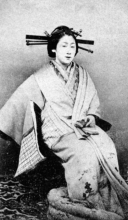 Japan: A late 19th century oiran or courtesan   prostitute, c. 1885 1890 The oiran were considered a type of y jo  prostitute   woman of pleasure  or prostitute. However, they were distinguished from the y jo in that they were entertainers, and many became celebrities of their times outside the pleasure districts. Their art and fashions often set trends among the wealthy and, because of this, cultural aspects of oiran traditions continue to be preserved to this day. br   br  They were distinguished from the y jo  woman of pleasure  or prostitute.  The oiran arose in the Edo period  1600 1868 . At this time, laws were passed restricting brothels to walled districts set some distance from the city center. In the major cities these were the Shimabara in Kyoto, the Shinmachi in Osaka, and the Yoshiwara in Edo  present day Tokyo .  br   br   br  These are the major cities.  These rapidly grew into large, self contained  pleasure quarters  offering all manner of entertainments. Within, a courtesan s birth Within, a courtesan s birth held no distinction, which was fortunate considering many of the courtesans originated as the daughters of impoverished families who were sold into this lifestyle as indentured servants.   Among the oiran, the tay   tayu  was considered the highest rank of courtesan and were considered suitable for the daimyo or feudal lords. In the mid 1700s courtesan rankings began to disappear and courtesans of all classes were collectively known simply as  oiran .  br   br    The word oiran comes from the Japanese phrase oira no tokoro no n san            which translates as  my elder sister . When written in Japanese, it consists of two kanji, flower meaning  flower , and kai meaning  leader  or  first , hence  Leading Flower  or  First Flower .
