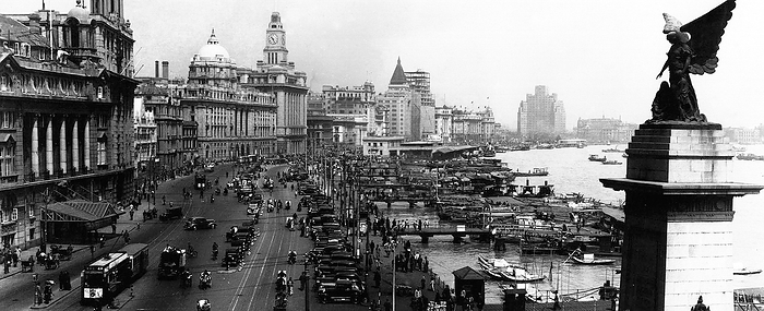 China: Shanghai, The Bund  Waitan , 1936. The Bund  Chinese: W it n  is an area of Huangpu District in central Shanghai. The area centres on a section of Zhongshan Road  East 1 Zhongshan Road  within the former Shanghai International Settlement, which runs along the western bank of the Huangpu River, facing Pudong, in the eastern part of Huangpu District. The Bund usually refers to the buildings and wharves on this section of the road, as well as some adjacent areas. 