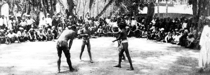 Burma: A boys  boxing match, c.1892 96. Lethwei is an unarmed Burmese martial art The British conquest of Burma began in 1824 in response to a Burmese attempt to invade India. By 1886, and after two further wars, Britain had incorporated the entire country into the British Raj. To stimulate trade and facilitate changes, the British brought in Indians and Chinese, who quickly displaced the Burmese in urban areas. To this day Rangoon and Mandalay have large ethnic Indian populations. Railways and schools were built, as well as a large number of prisons, including the infamous Insein Prison, then as now used for political prisoners. br   br    Burmese resentment was strong and was vented in violent riots that paralysed Rangoon on occasion all the way until the 1930s. Burma was administered as a province of British India until 1937 when it became a separate, self governing colony. Burma finally gained independence from Britain on January 4, 1948. 