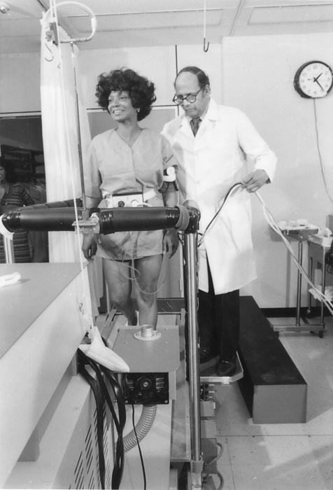 Nichelle Nichols, recently hired by the National Aeronautics and Space Administration to acquaint potential minority applicants throughout the United States with the oppotunities available to them in the shuttle astronaut recruitment program. Here, she familiarized herself with the treadmill, one of the devices used in the pre-flight testing of the crews. 1977. NASA Photo/ 