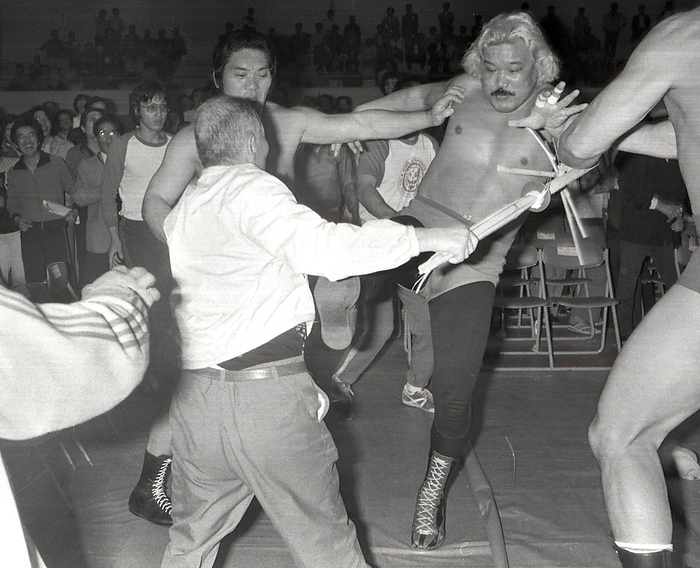 1979 New Japan Pro Wrestling: Excited fan intervenes with a bamboo sword in an off site fight. May 29, 1979   New Japan Pro Wrestling Excited spectators at an off site fight between Kobayashi Long and Umanosuke Ueda intervened with shinai swords.