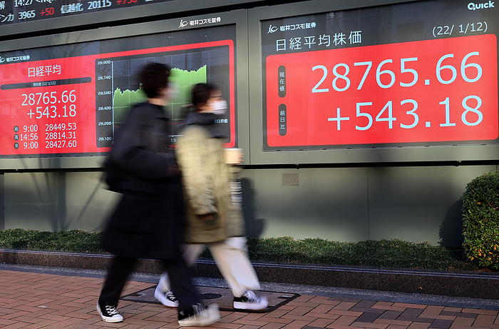 Japan s share prices rose 543.18 yen at the Tokyo Stock Exchange January 12, 2022, Tokyo, Japan   Pedestrians pass before a share prices board in Tokyo on Wednesday, January 12, 2022. Japan s share prices rose 543.18 yen to close at 28,765.66 yen at the Tokyo Stock Exchange.     Photo by Yoshio Tsunoda AFLO 