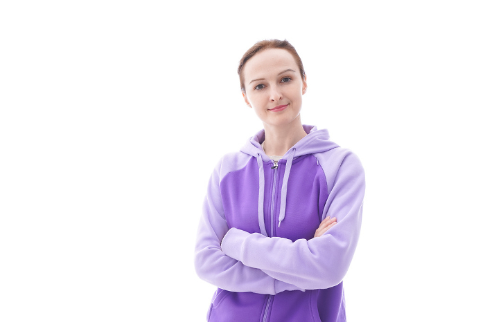 Portrait image of a woman wearing a hoodie.