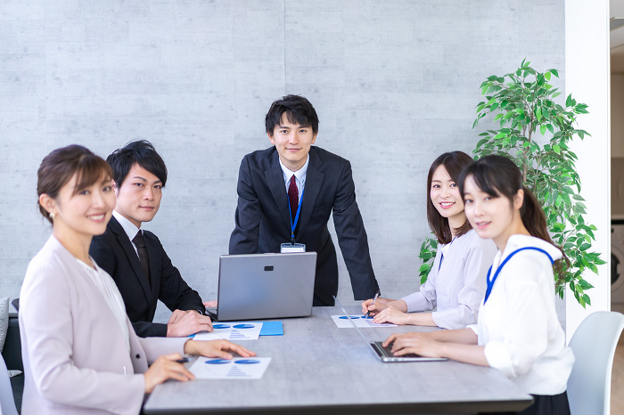 Japanese office workers having a business meeting in an office (Male/Female / People)