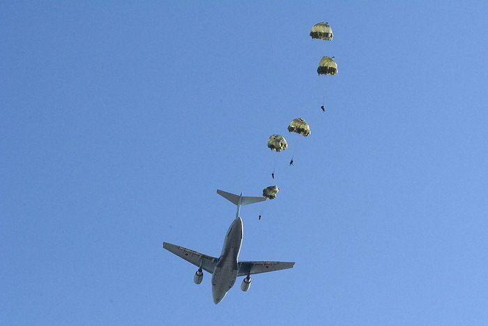 Paratroopers jumping out of an Air Self Defense Force transport plane and parachuting Paratroopers jump out of an Air Self Defense Force transport aircraft and parachute into the sky over the Narashino Training Area of the Ground Self Defense Force on January 1, 2022. Photo taken by Yoshitake Matsuura at 0:03 p.m. on March 3.