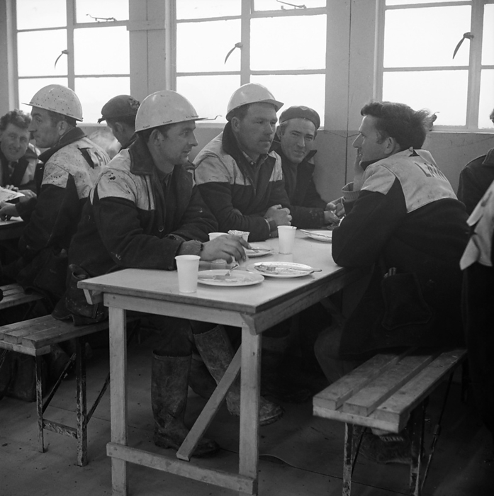 Heathrow Airport, BEA Servicing Hangar, Heathrow, Hillingdon, London, 07 04 1970. Creator: John Laing plc. Heathrow Airport, BEA Servicing Hangar, Heathrow, Hillingdon, London, 07 04 1970. Laing workmen talking at a table in the site canteen during the construction of the BEA aircraft servicing hangar at Heathrow Airport. In October 1969 Laing announced that its Industrial Engineering Branch had been awarded a contract for construction of an aircraft servicing hangar for British European Airways at Heathrow Airport. It was the company  x2019 s second major contract at Heathrow, following the completion of the BEA and BOAC cargo terminal.