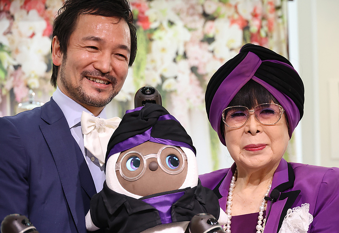 Announcing a wedding dress exclusively for LOVOT January 20, 2022, Tokyo, Japan   Japan s robot venture Groove X president Kaname Hayashi  L  smiles with bridal fashion designer Yumi Katsura  R  as they display Yumi Katsura look alike communication robot LOVOT at Katsura s main wedding dress shop in Tokyo on Thursday, January 20, 2022. Yumi Katsura s wedding garments for the robot LOVOT will go on sale from January 21 with a price of 66,980 yen.      Photo by Yoshio Tsunoda AFLO  