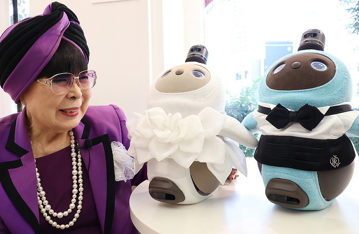 Announcing a wedding dress exclusively for LOVOT January 20, 2022, Tokyo, Japan   Japanese bridal fashion designer Yumi Katsura displays Groove X s communication robot LOVOT wearing wedding dresses designed by Katsura at Katsura s main wedding dress shop in Tokyo on Thursday, January 20, 2022. Yumi Katsura s wedding garments for the robot LOVOT will go on sale from January 21 with a price of 66,980 yen.      Photo by Yoshio Tsunoda AFLO  