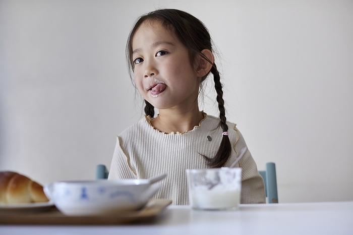 Japanese girl eating yogurt