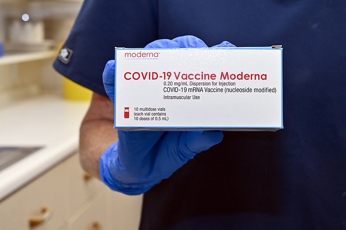 Moderna covid 19 vaccine Moderna covid 19 vaccine. The vaccine consists of strands of mRNA  messenger ribonucleic acid  encased in lipid nanoparticles. The mRNA codes for a mutated version of the viral spike protein found on the surface of the SARS CoV 2 coronavirus that causes covid 19. When injected into the body the mRNA is taken up by the body s cells, which manufacture copies of the protein. The proteins stimulate an immune response, causing the body to produce antibodies against the spike protein. This means that the body is primed to attack the virus should it be encountered after vaccination, preventing disease., Photo by DR P. MARAZZI SCIENCE PHOTO LIBRARY
