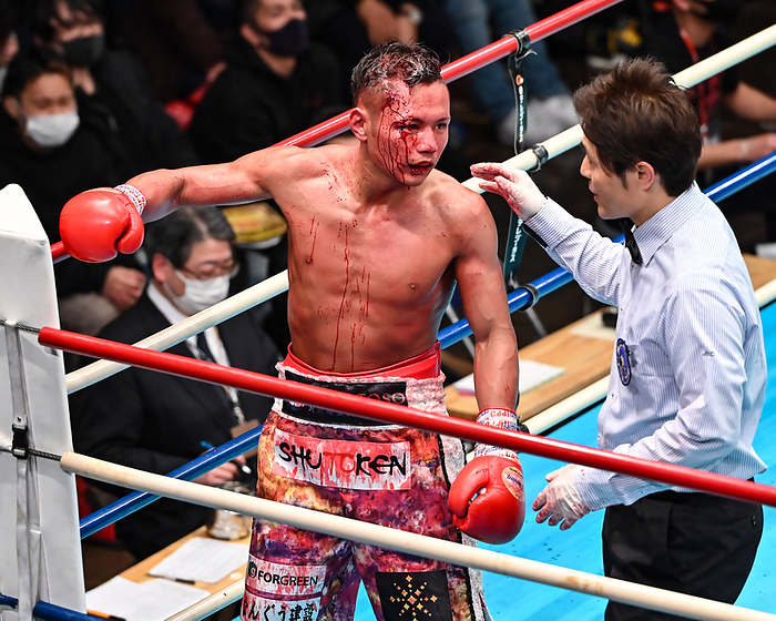 Japan Bantamweight Title Match Referee Nobuhiro Matsubara, right, encourages Kyosuke Sawada to be checked by a doctor in the fifth round during the vacant Japanese Bantam Title bout at Korakuen Hall in Tokyo, Japan, February 5, 2022.  Photo by Hiroaki Finito Yamaguchi AFLO 