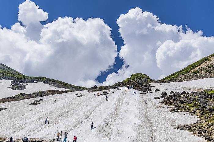 Summer skiing and cumulonimbus clouds at Norikura-daisetsukkei, Nagano, Japan