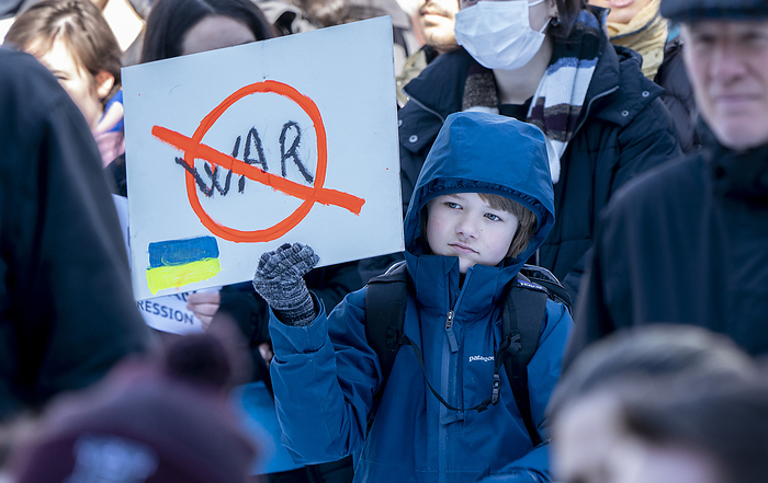 Ukrain rally at Harvard University February 26, 2022, Harvard University, Cambridge, Massachusetts, USA: Child holds  no war   sign during rally  Harvard Stands with Ukraine  rally on Harvard Yard at Harvard University in Cambridge. 