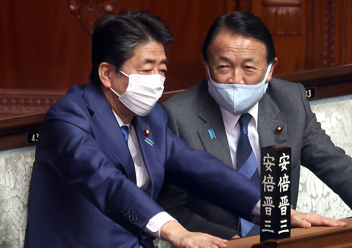 Plenary session of the lower house of the Diet adopts resolution condemning Russia. March 1, 2022, Tokyo, Japan   Former Japanese Prime Ministers Shinzo Abe  L  and Taro Aso  R  chat each other at Lower House s plenary session at the National Diet in Tokyo on Tuesday, March 1, 2022. Japan s Lower House adopted a resolution of condemning Russia for its military invasion to Ukraine.    Photo by Yoshio Tsunoda AFLO  