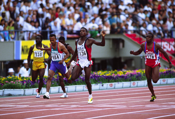 Carl Lewis (USA), Frank Frederics (NAM),
AUGUST 25, 1991 - Athletics : Carl Lewis #1136 of the USA and Frank Frederics #804 of Namibia finish during the Men's 100m semifinal at the 1991 World Championships in Athletics at National Stadium in Tokyo, Japan. 
(Photo by Shinichi Yamada/AFLO) [0348]