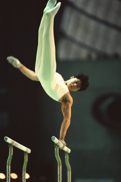 Koichi Mizushima (JPN)
MAY 3, 1986 - Artistic Gymnastics : Koichi Mizushima of Japan in action during the Men's Gymnastics Parallel Bars at the International 4 nations competition.
(Photo by Shinichi Yamada/AFLO) [0348].