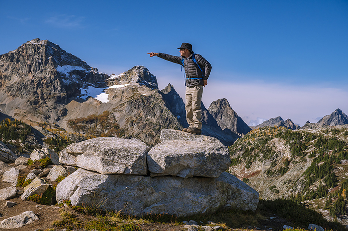 Guy standing on a ridge being goofy, Mazama, Washington, United States