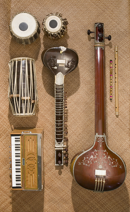 Traditional Indian instruments Traditional Indian instruments, including dholak and tabla drums, sitar, tanpura, flute, harmonium., Photo by DK IMAGES SCIENCE PHOTO LIBRARY